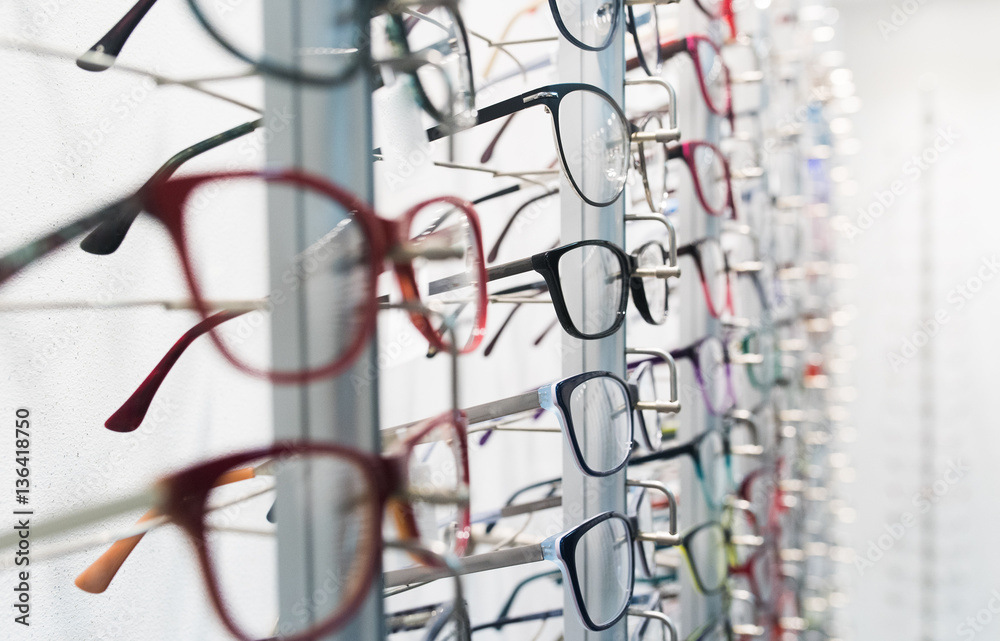 Wall mural row of eyeglass at an opticians store