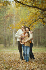 Fototapeta premium Family of four in autumn 