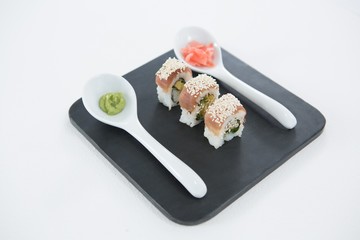 Nigiri sushi roll served on black stone slate