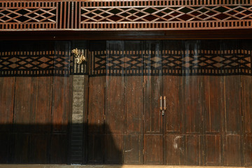 Reflection of sunlight on wooden door