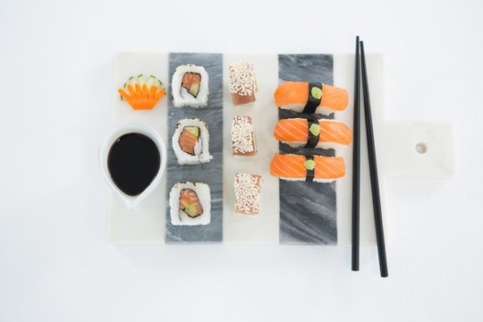 Set of assorted sushi served on gray stone slate