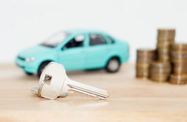 car and coins on a white background