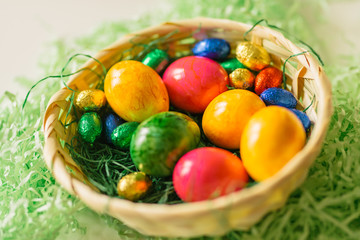 Fototapeta na wymiar colored eggs in basket