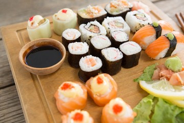 Set of assorted sushi served on wooden tray
