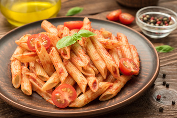 Penne with tomato sauce, basil and tomatoes