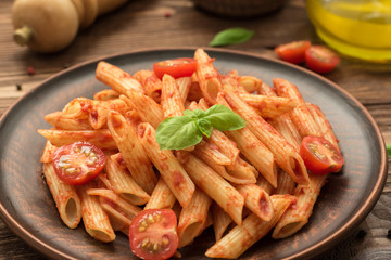 Penne with tomato sauce, fresh basil and tomatoes