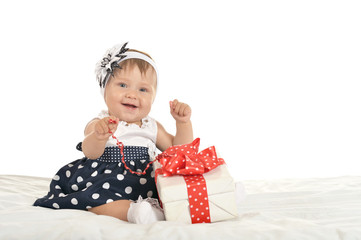 Cute baby girl with gift