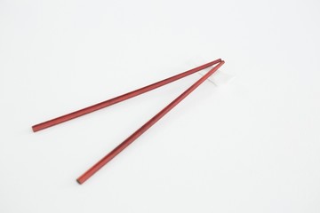 Red chopsticks on a chopstick rest