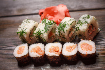 rolls of ginger on a wooden table