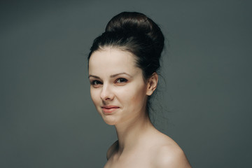 gray background, bunch on head, hairdress