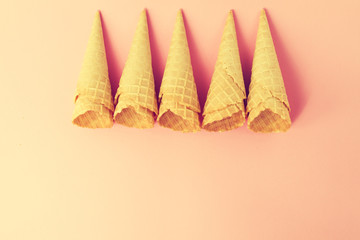 Empty Colorful Pastel Toning Ice Cream Cones on Pink Background.
