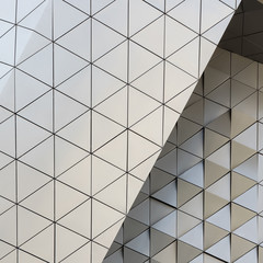 Abstract 3d illustration of modern aluminum ventilated facade of triangles