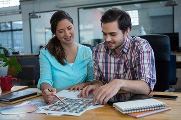 Fototapeta premium Graphic designers working at desk