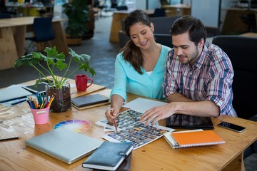 Graphic designers working at desk