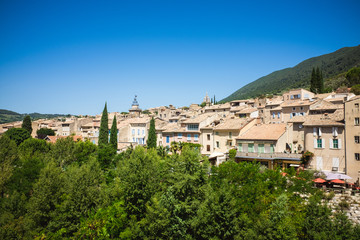 Fototapeta na wymiar Panorama of french city with trees and roofs