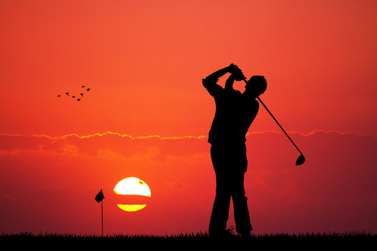 man play golf at sunset