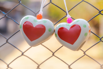 Heart toys on the cage metal net