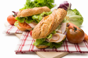 Sandwich with turkey roast, cheese and vegetables