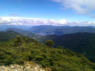 Green forest and rolling clouds from the summit of San Sebastian 