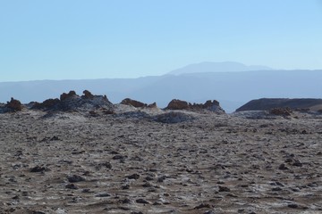 Moon like landscape with mountains stretching far into the distance, San Pedro de Atacama Chile.