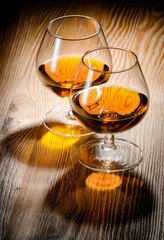 Whiskey or brandy on a wooden table