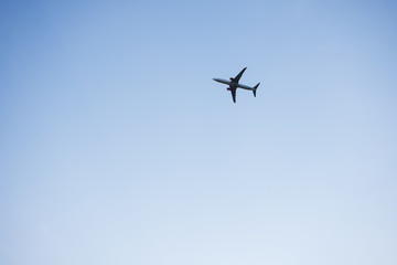 Passenger plane on the background of cloudy sky day.