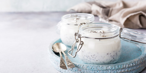 Chia seed pudding in glass jar. Superfoods concept with copy space.