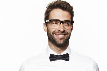 Smiling man in shirt and bow tie