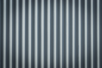 Corrugated metal sheet. Bluish background pattern.