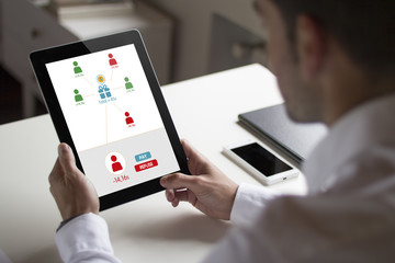 businessman spliting expenses between a group of people with tab