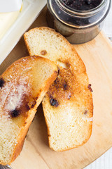 butter, toast and jam closeup on white background