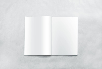 Opened blank magazine pages mockup, isolated on textured background. White journal mock up lying on...