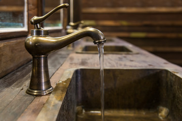 Brass faucet vintage style with flow water