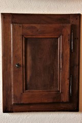 Fototapeta na wymiar Wooden wall cabinet, Italian style