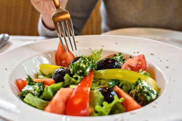 Fresh Greek salad closeup in a restaurant