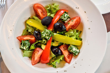 Fresh Greek salad closeup in a restaurant