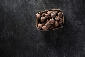 Walnuts over dark background