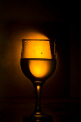 a glass of wine and splashes