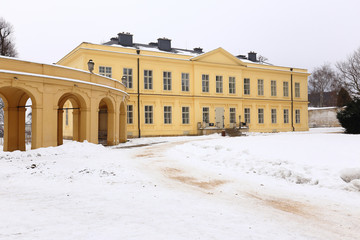 Fototapeta na wymiar Large yellow renovated building of Ploskovice castle