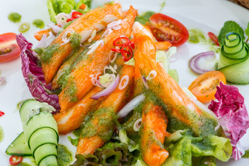 Crab-stick Salad, closeup crab salad with parsley decorated back