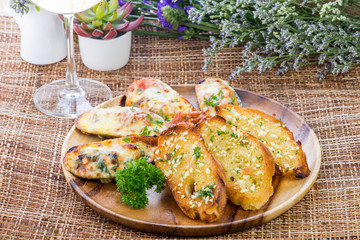 Mussels baked with cheese and garlic ,toasts with basil and garl