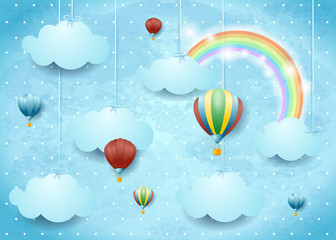 Obraz premium Surreal cloudscape with hot air balloons and rainbow