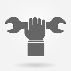 Hand holding spanner icon