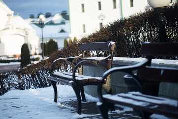 benches in the city park in the winter