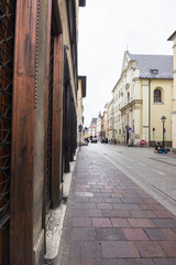 Fototapeta na wymiar Architecture of streets of Krakow, Poland town in rainy day