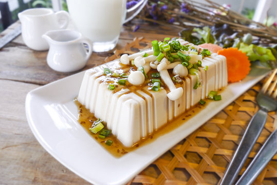 tofu with milk on the wooden table