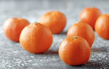 Delicious and beautiful Tangerines. Peeled Tangerine orange and Tangerine orange slices on a Dark Background. Citrus background