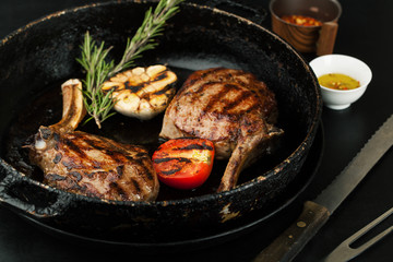 Grilled veal ribs with herbs, spices, garlic and rosemary