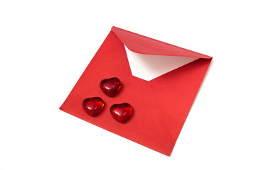 Gift for Valentines day. Red hearts and open envelope on the white background.