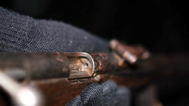 Man holds old rifle in hands